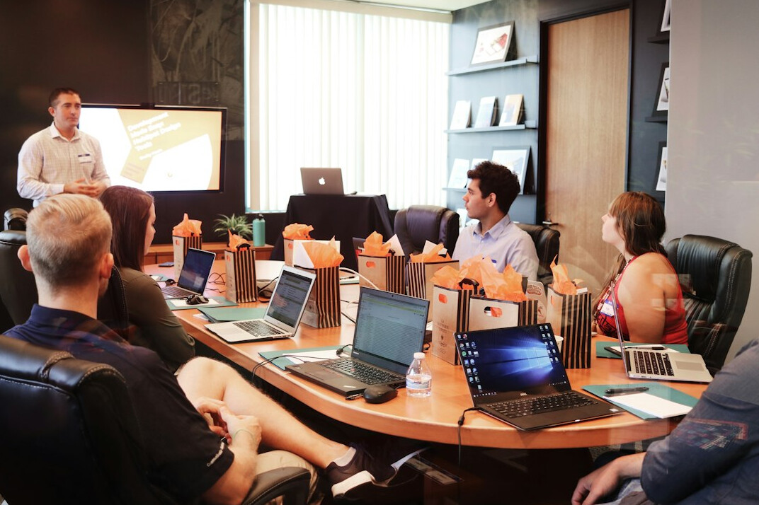 team meeting about insurance tech