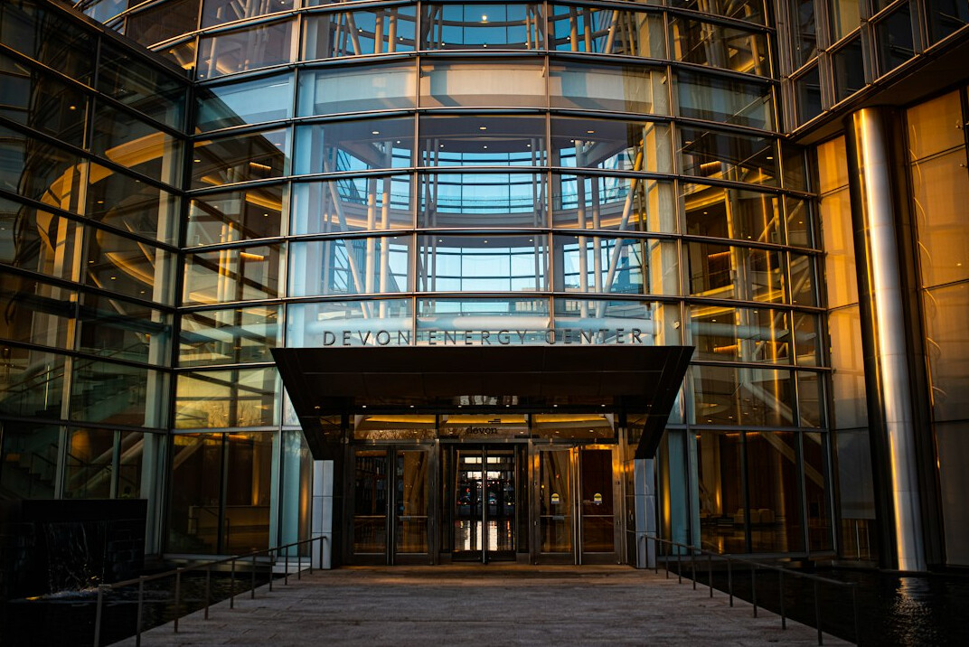 Modern glass office building entrance in a business district